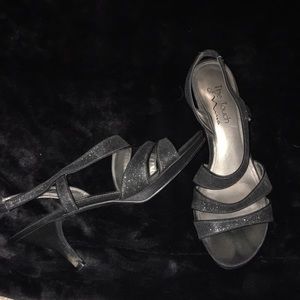 Worn black , sparkly strappy heels